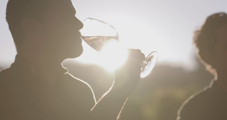 Guest enjoying a glass of rosé in warm evening sunlight
